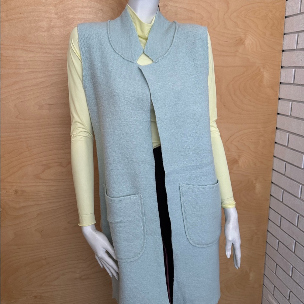 Light blue knitted raw edge vest overcoat